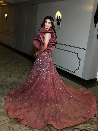 Another shot of this breathtaking engagement look. The long train of the gown and the sophisticated makeup create a truly memorable image.