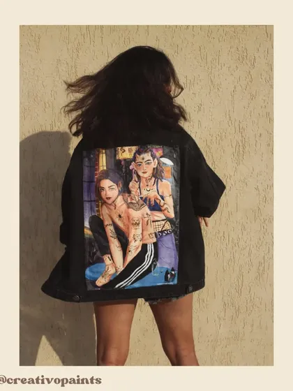 The wind catching her hair, this photo gives a sense of movement and life to the jacket. It shows that this is not just art, but functional, wearable fashion.