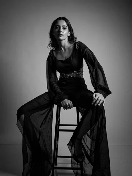 The full look, showing how the makeup works with the entire styling to create a cohesive, artistic image.