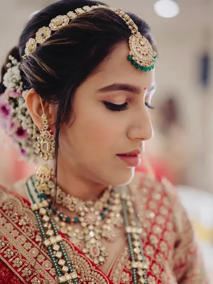 A close-up of this bride's serene phera look. The makeup is soft and defined, focusing on her eyes and flawless skin.