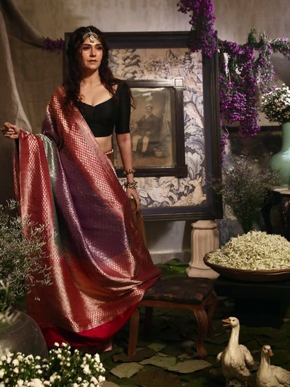 An artistic, full-length portrait for a handloom saree brand. We created a custom, rustic set within the studio to complement the traditional aesthetic of the collection, demonstrating our ability to build unique worlds for your brand.