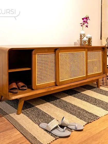 Meet Penthes, my solution for an elegant and organized entryway. This shoe rack, crafted from rich teak with sliding rattan doors, combines practical storage with a refined aesthetic that welcomes you home.