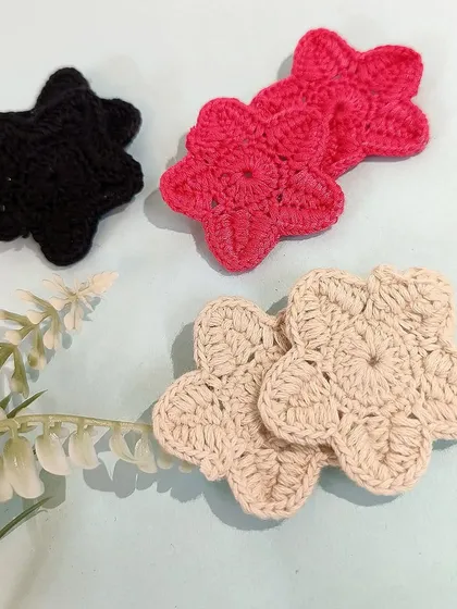 My cute handmade crochet flower earrings, available in black, pink, and beige.