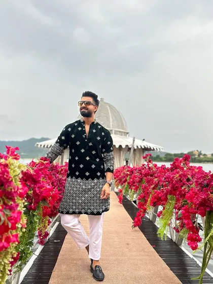 Walking on a flower-decked path over the lake in Udaipur. This is the kind of fairytale setting that makes destination weddings so special.