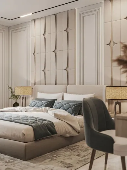 We believe a bedroom should be a personal sanctuary. This space features a fully upholstered bed and a custom-paneled accent wall, creating a serene and sophisticated atmosphere that balances comfort with high-end design.