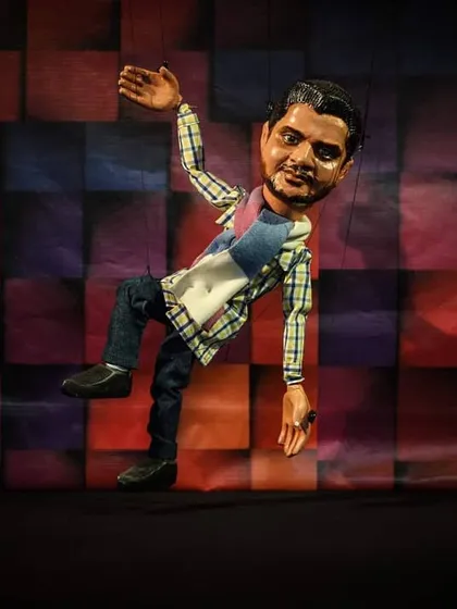 A custom-made marionette puppet designed to look like a specific person, showcasing our ability to create personalized characters.