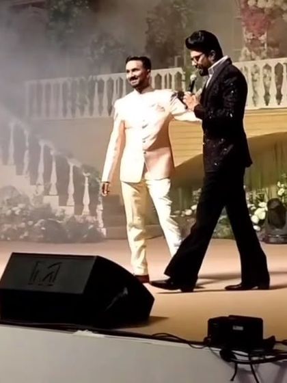 A moment of appreciation on stage with Manish Paul. Sharing my art at such high-profile events is an incredible experience.