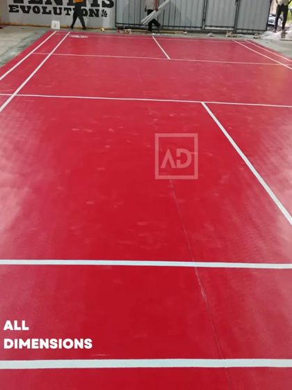 Another angle of the badminton court installation, showing the clean, sharp lines required for professional play.
