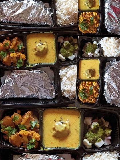 A display of different thali combinations, including kadi with aloo gobhi and kadi with paneer bhurji. There's something for everyone.