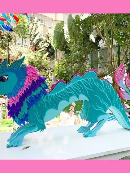 From mythical creatures to storybook characters, I love bringing imagination to life. This large, colorful Sisu dragon from 'Raya and the Last Dragon' was handcrafted from paper and cardboard, serving as a magical centerpiece for a fantasy-themed birthday party.