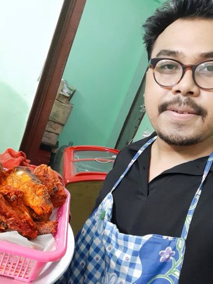 The chef on duty, proud to be serving up delicious fried chicken.