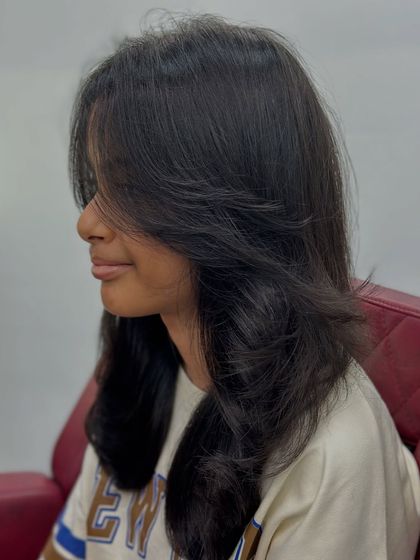 Another angle of this lovely layered cut. The soft ends and face-framing pieces create a very flattering look.