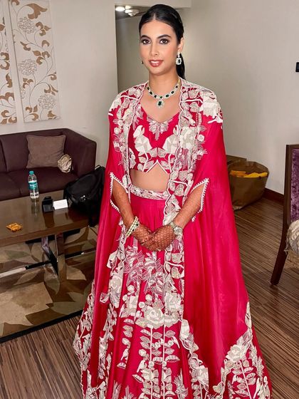 A full-length view of this unique and stylish reception ensemble. The simple, elegant makeup ensures the focus remains on the stunning outfit.