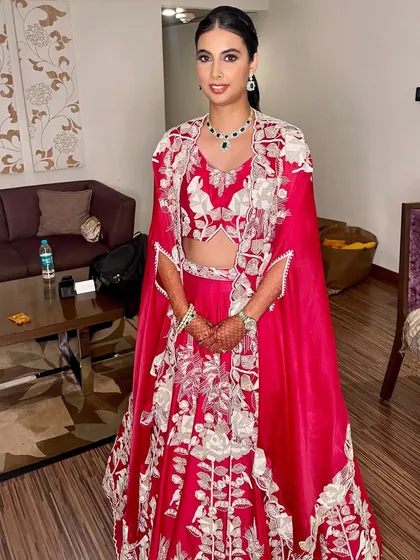 A full-length view of this unique and stylish reception ensemble. The simple, elegant makeup ensures the focus remains on the stunning outfit.