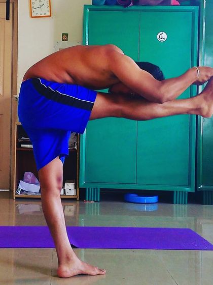 Dandayamana Janushirasana (Standing Head-to-Knee Pose). This challenging balancing asana stretches the ankle muscles and builds immense focus and stability.