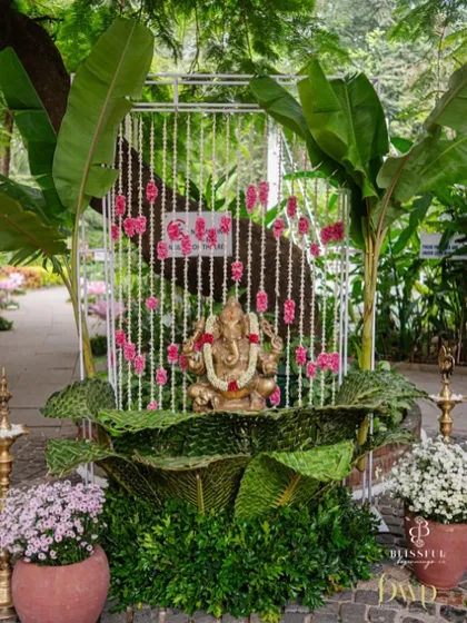 We believe every celebration should start with a blessing. This Ganesha installation, decorated with fresh banana leaves and strings of tuberose and carnations, provided a divine and traditional welcome for a South Indian wedding.