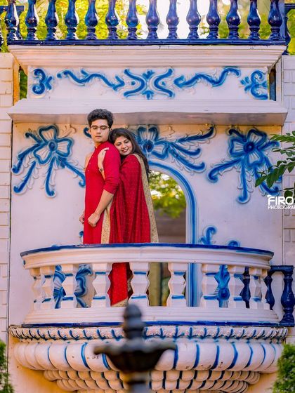 A romantic pose on the Santorini-inspired balcony, a perfect spot for a dreamy and picturesque photo.
