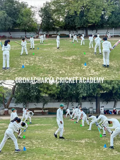 Learning the basics of cricket at an early age is crucial. Here, a group of our youngest players participate in a shadow batting drill, building a strong foundation of technique and form.