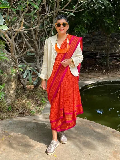 We believe in giving beautiful textiles a second life. This image showcases our overprinting service, where we take a pre-loved vintage Kanjeevaram silk saree from our founder's personal collection and refresh it with a vintage 'chunadi' block print.