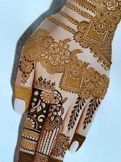 A practice sheet showing a very detailed and modern back-hand design. I love experimenting with different styles and textures in my sketches.