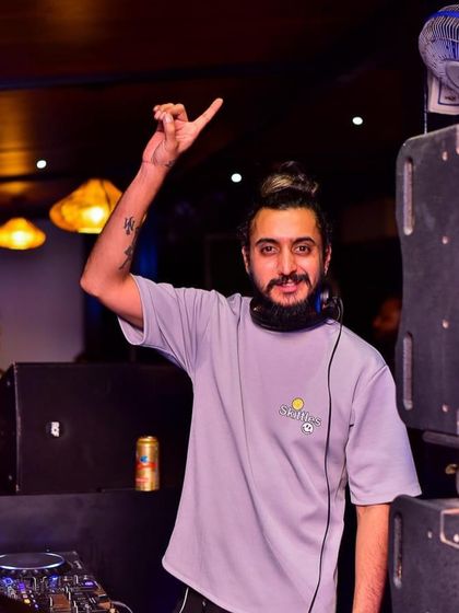 A classic pose at the DJ booth. My motivation and attitude are what drive me to give my best performance every single time.