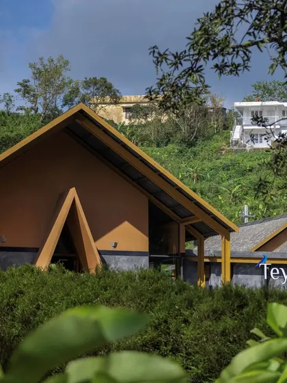 The exterior of our Teyla tea shop in Idukki, Kerala. The design uses a modern interpretation of the traditional sloping roof and an A-frame entrance to create a welcoming presence.