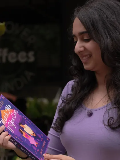 A close-up shot of me with my debut novel. *Match Me If You Can* is a laugh-out-loud desi romance that I'm so proud of.
