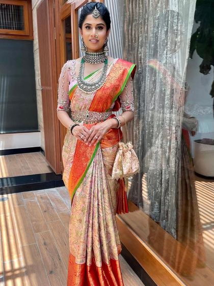 A full-length view showing how the entire ensemble comes together. The makeup remains elegant and understated, allowing the outfit to shine.