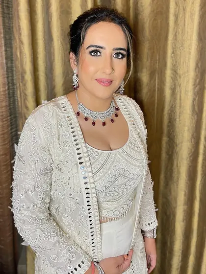 She looks absolutely radiant and confident. This is a perfect example of how less can truly be more when it comes to makeup.