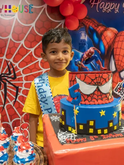 From the cake to the backdrop, I love bringing superhero dreams to life. Here, the birthday boy stands proudly with his amazing Spiderman-themed cake, ready for an action-packed celebration.