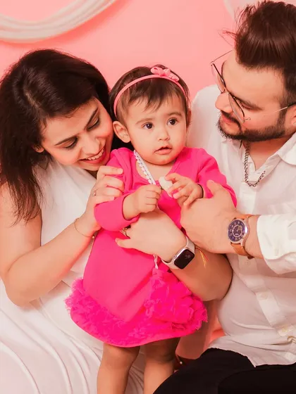 A sweet family of three. The love and affection between them is beautifully captured in this photo.