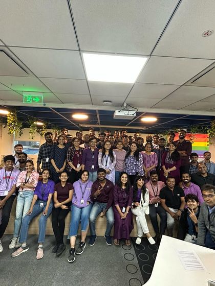 A wider group photo of our team celebrating Pride Month. This event reflects our core values of diversity, inclusion, and creating a welcoming environment for all.