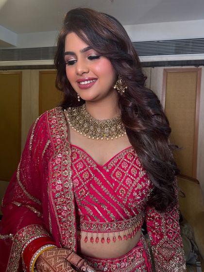 A close-up of Megha's reception makeup, featuring soft smokey eyes and a beautiful nude lip.