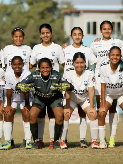 The SheWolves starting eleven posing for a team photo before their match against Warriors FC, looking united and ready to compete.