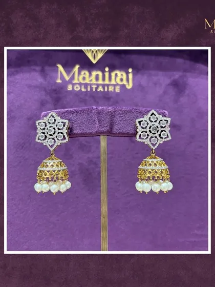 A classic with a twist. These stunning jhumkas feature a star-shaped Polki top with a traditional gold and pearl jhumka base, perfect for any celebration.