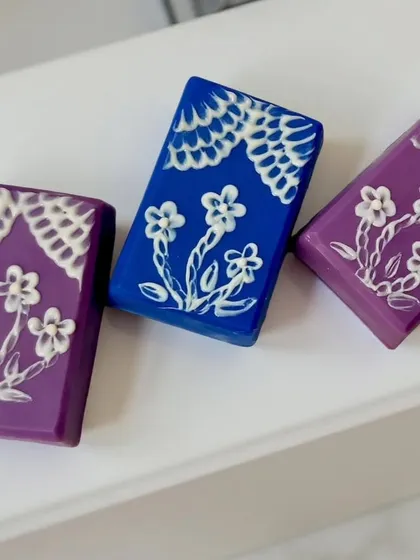 A different angle of the brush embroidery soaps. The technique involves piping soap and then dragging a brush through it to create an embroidered look.