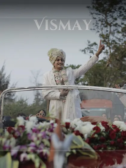 A classic groom's entry in a vintage car, looking every bit the modern royal. We source the perfect props to match your wedding's aesthetic.
