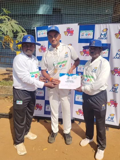 Siddharth receiving his Man of the Match award for taking crucial wickets in the final.