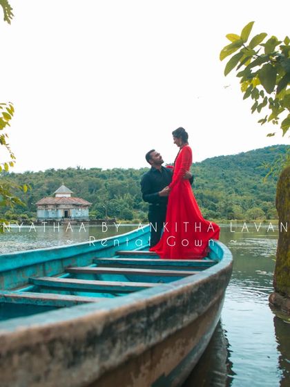 A serene shot by the lake, showcasing the elegance of my rental red gown. It's a perfect choice for couples looking for a memorable pre-wedding shoot.