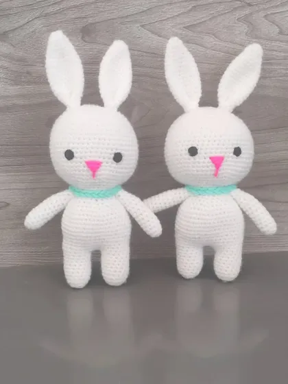 A pair of sweet white bunnies. They are simple, classic, and very soft to the touch.