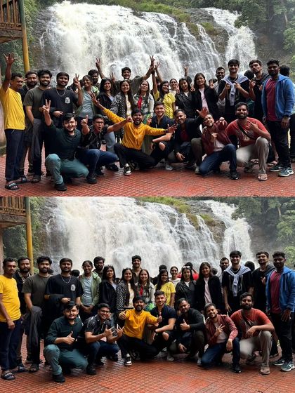 A group photo in front of a gushing waterfall in Coorg. Visiting waterfalls is a key part of our monsoon itineraries, offering spectacular views and photo opportunities.