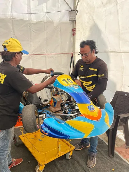 Our mechanics working on a Micro driver's kart.