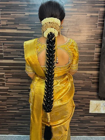 Being a complete makeup artist means mastering hairstyling too. This traditional South Indian bridal braid, intricately woven and adorned with flowers, is one of the many hairstyling techniques you will learn in my professional diploma course.