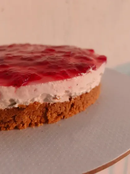 Another look at the delicious strawberry cheesecake. The balance of the crunchy base, smooth filling, and sweet-tart fruit topping makes it a perfect dessert.