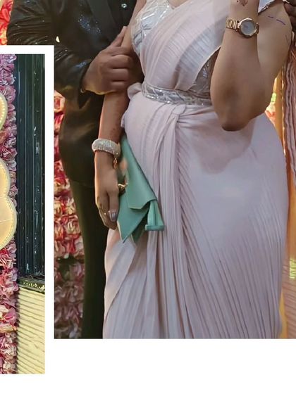 A close-up of the couple's reception look. The texture of her pleated saree and his tuxedo jacket show how details can make an outfit special.