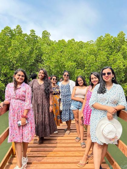 Our group on the mangrove boardwalk in Honnavar, surrounded by lush greenery.