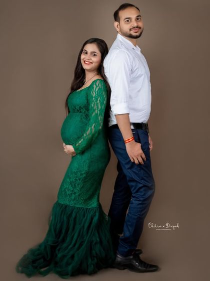 A classic back-to-back pose that is both stylish and timeless. A perfect way to capture the couple's partnership.