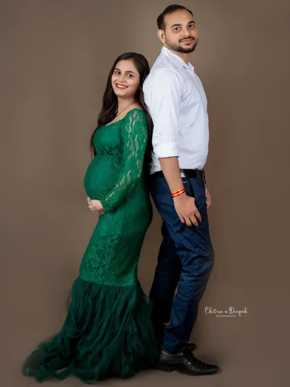 A classic back-to-back pose that is both stylish and timeless. A perfect way to capture the couple's partnership.