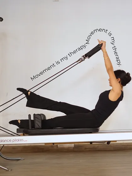 "Movement is my therapy." This client demonstrates a beautiful teaser variation on the reformer, perfectly capturing how Pilates can be a release for the mind and body.