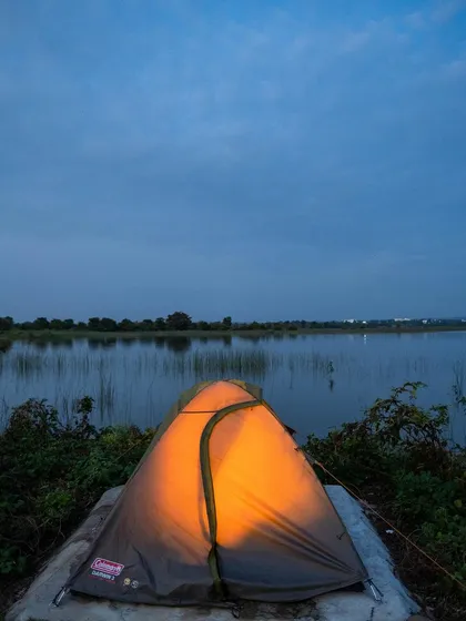 Your personal escape awaits. Imagine waking up in a cozy, lit tent right by the serene waters of a lake. This is our luxury lakeside camping experience, a perfect way to disconnect and recharge.
